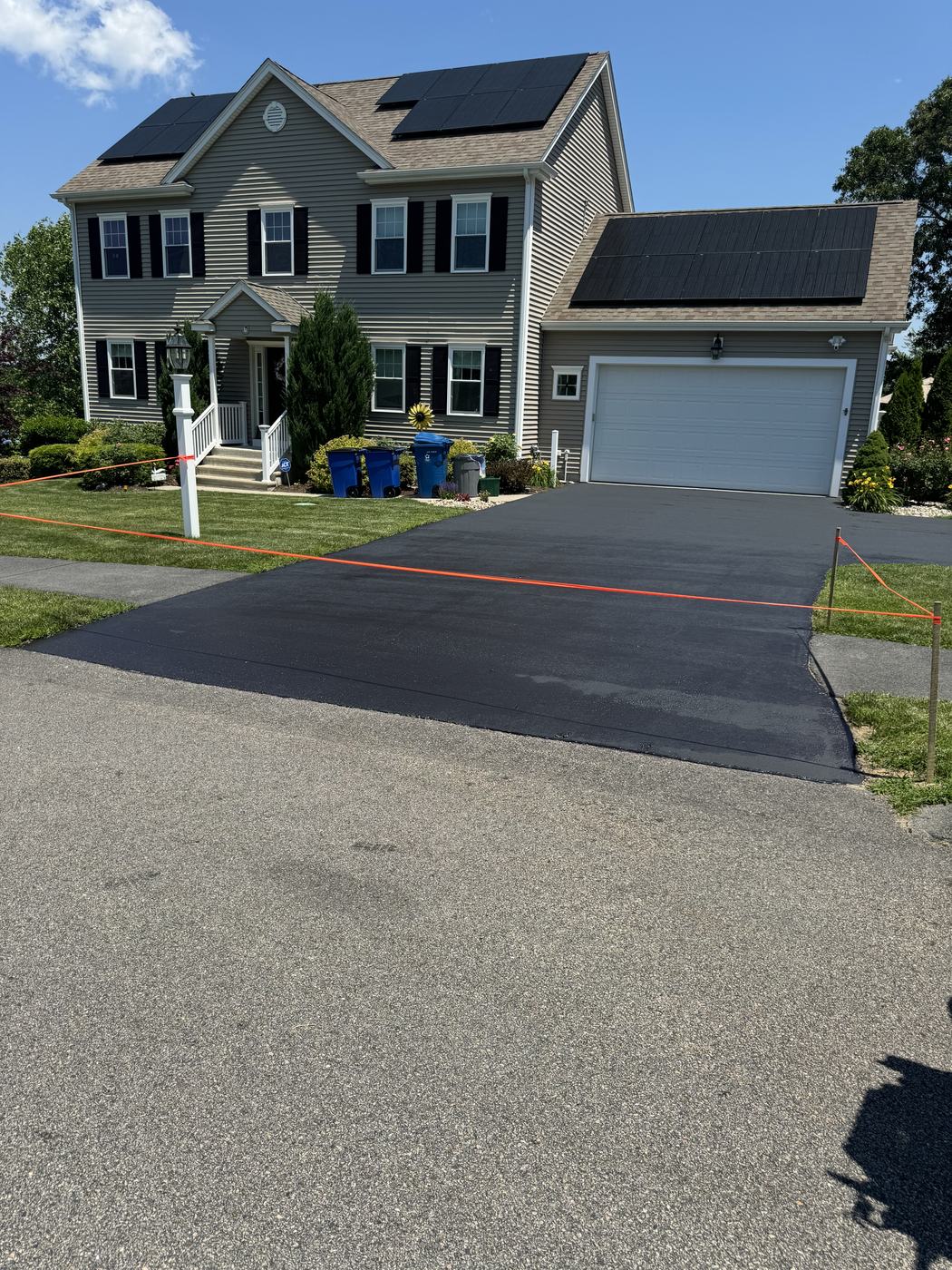 Freshly sealed two-car driveway at a residential property