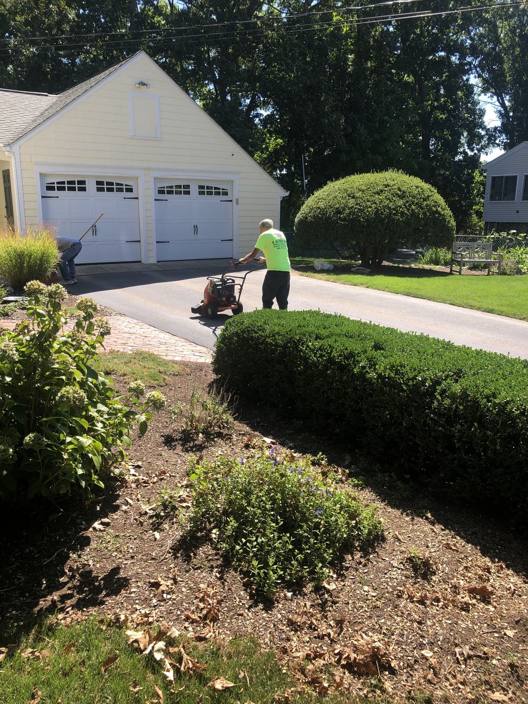 Finished residential sealcoating project with sharp clean lines
