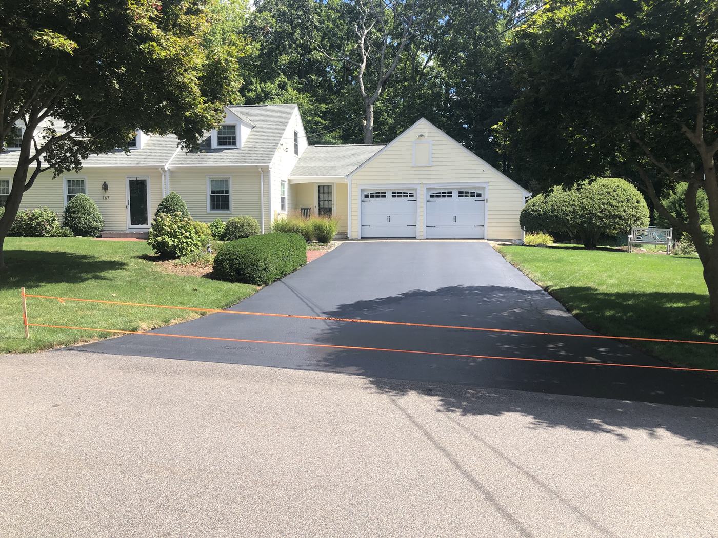 Clean sealed driveway at a suburban home